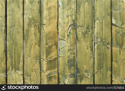 Cracked weathered green and blue painted wooden board texture. The cracked weathered green and blue painted wooden board texture