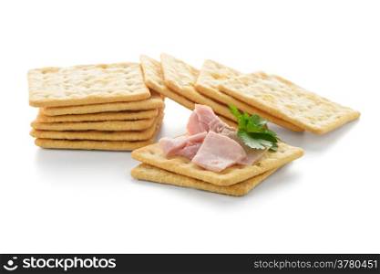 Crackers with Ham isolated on white background.