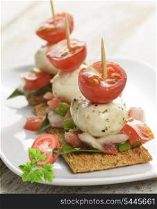 Crackers With Mozzarella Cheese And Tomatoes