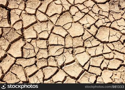 Cracks of the dried soil background