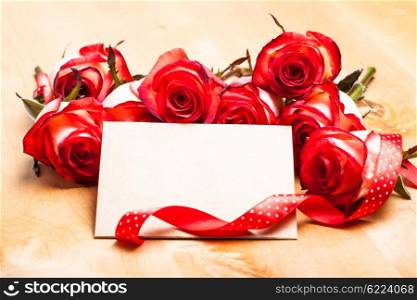 Craft card with red roses and ribbon for greetings. Card for greetings