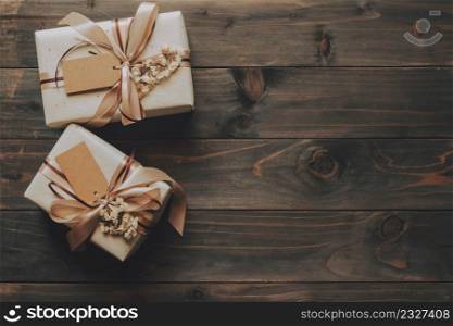 Craft gift box on table wooden background with copy space