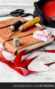 crafts with leather and tools for sewing. needlework and sewing