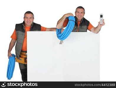craftsman and his clone phone in hand carrying fluorescent blue hose and