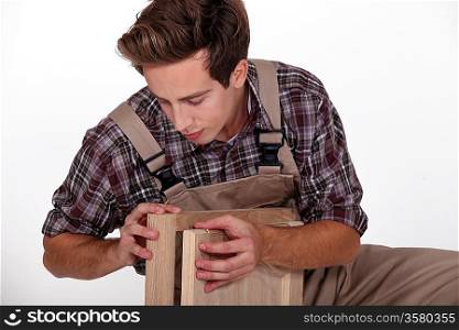craftsman assembling wooden pieces