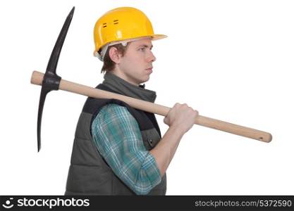 craftsman carrying a pick on his shoulder