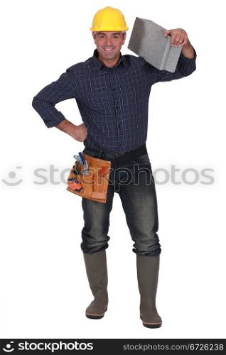 craftsman carrying a stone block on his shoulder