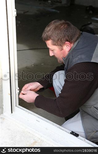 craftsman crewing a window