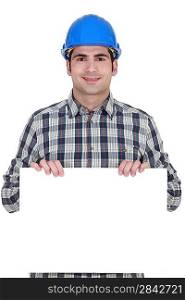 craftsman holding a blank poster
