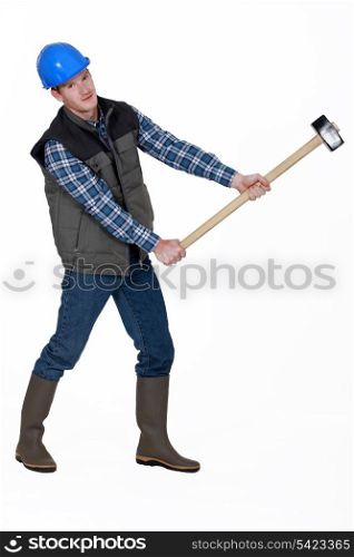 craftsman holding a huge hammer