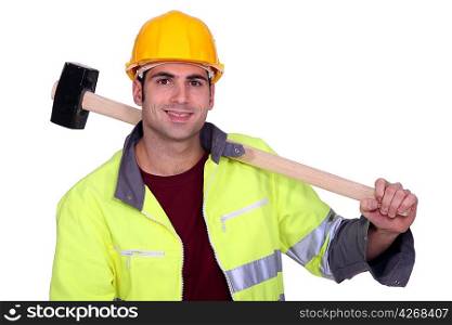 craftsman holding a huge hammer on his shoulder