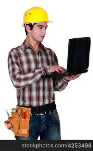 craftsman holding a laptop