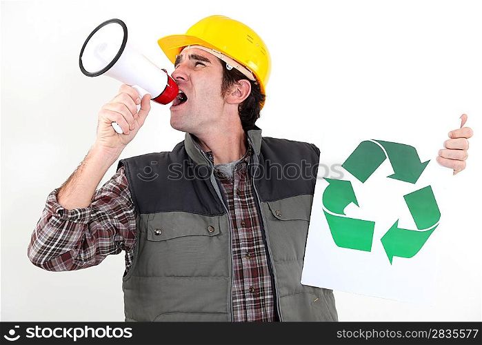 craftsman holding a recycling label and shouting through a megaphone