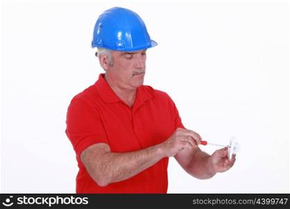 craftsman holding a screwdriver