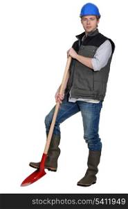 craftsman holding a shovel
