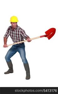 Craftsman holding a shovel