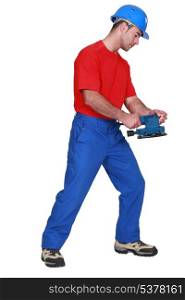 craftsman holding a tool
