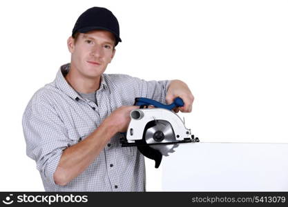 Craftsman holding an electric saw