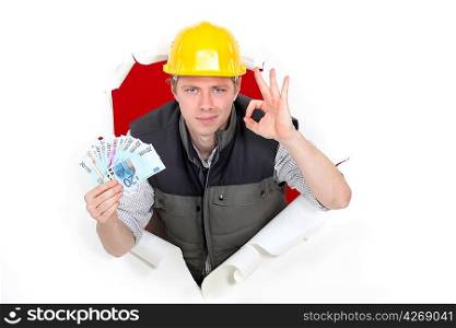 craftsman holding money and making an okay sign