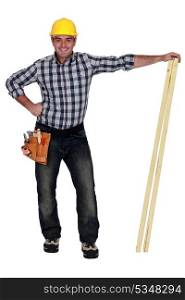 craftsman holding two wooden boards