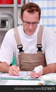 craftsman in his office describing a product