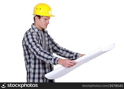 craftsman looking at a blueprint