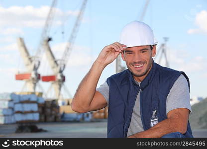 craftsman on a construction site smiling