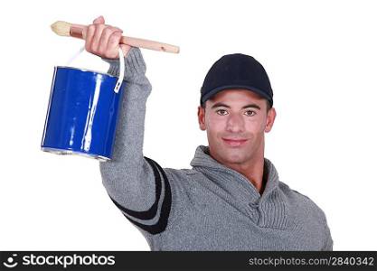 craftsman painter holding a can and a brush