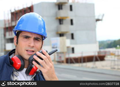 craftsman talking on a talkie walkie