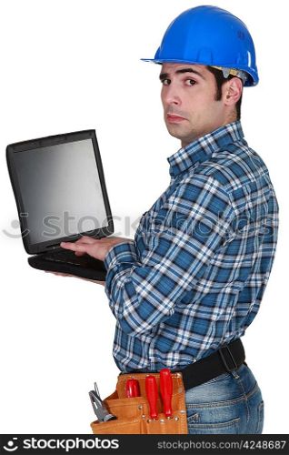 craftsman typing on his laptop