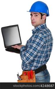 craftsman typing on his laptop