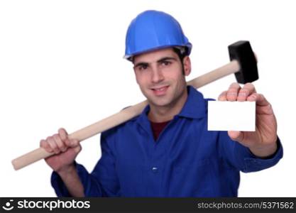 Craftsman with hammer and card