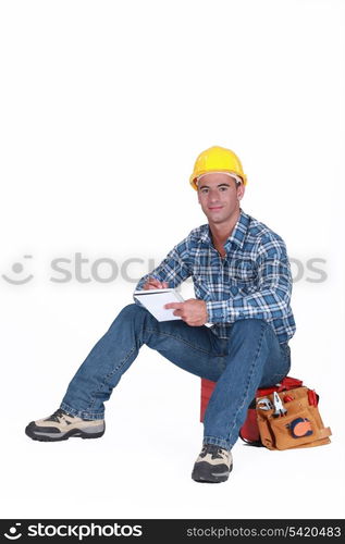 Craftsman with notebook