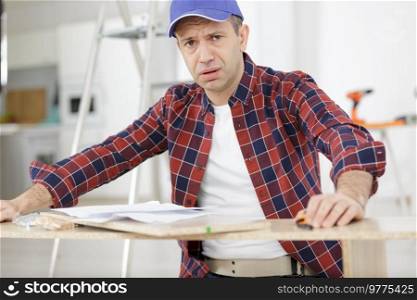 craftsmen man having doubts with confuse face expression