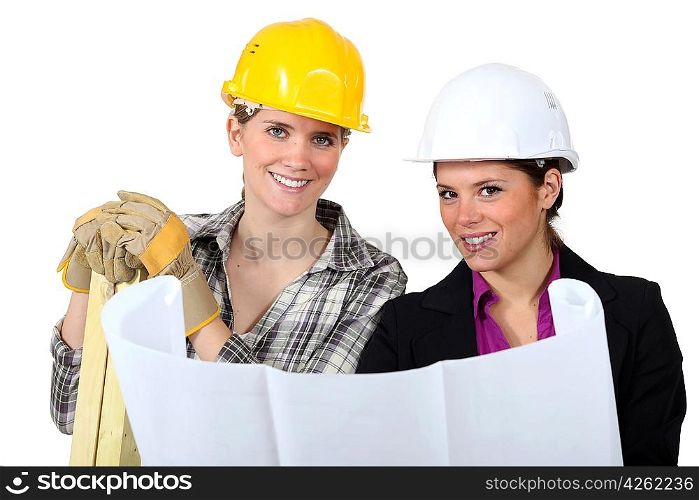 craftswoman and businesswoman looking at a blueprint