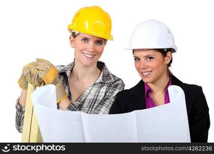 craftswoman and businesswoman looking at a blueprint
