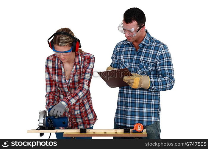 craftswoman and craftsman working together in their workshop