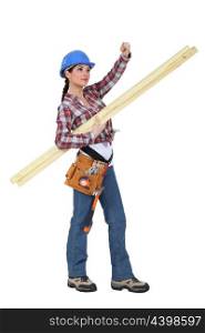 craftswoman carrying wooden boards