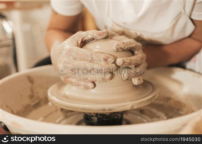 craftswoman creating pottery working wheel shaping clay. High resolution photo. craftswoman creating pottery working wheel shaping clay. High quality photo