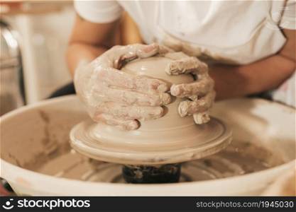 craftswoman creating pottery working wheel shaping clay. High resolution photo. craftswoman creating pottery working wheel shaping clay. High quality photo