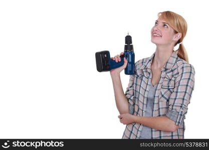 craftswoman holding a drill