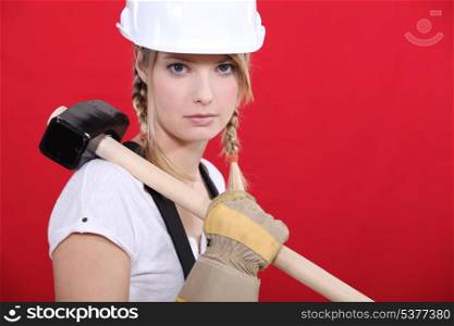 craftswoman holding a hammer