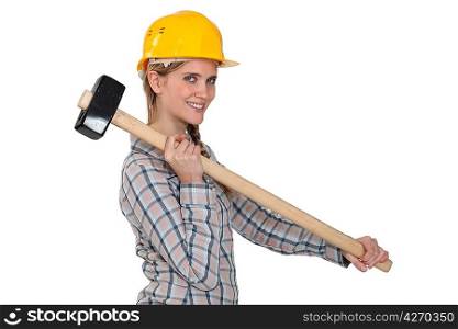 craftswoman holding a huge hammer