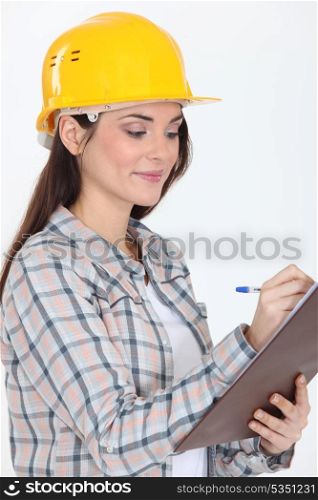 Craftswoman holding a notepad