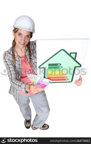 craftswoman holding energy consumption label