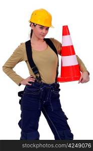 craftswoman holding traffic cone