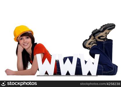 craftswoman posing behind a WWW ad
