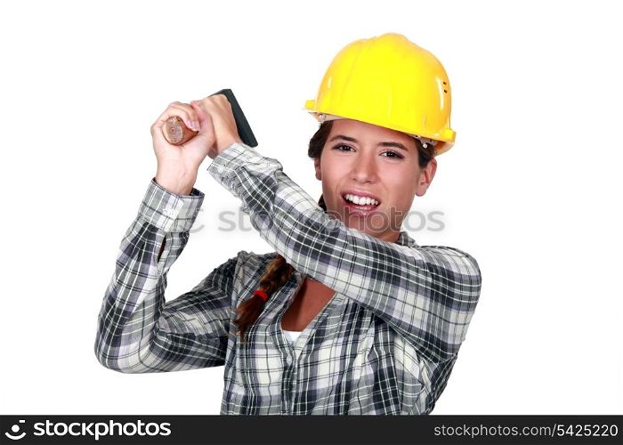 craftswoman striking with a hammer