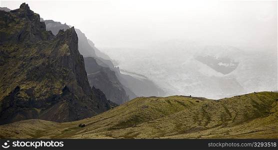 Craggy mountain, misty glacier, rolling hills
