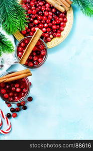 cranberry drink and berries, christmas drink in glass and on a table